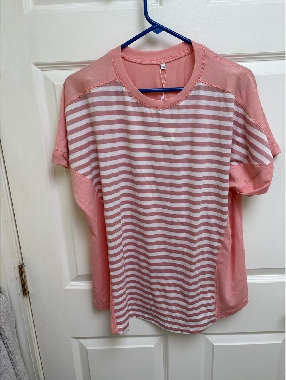 Woman’s pink striped shirt